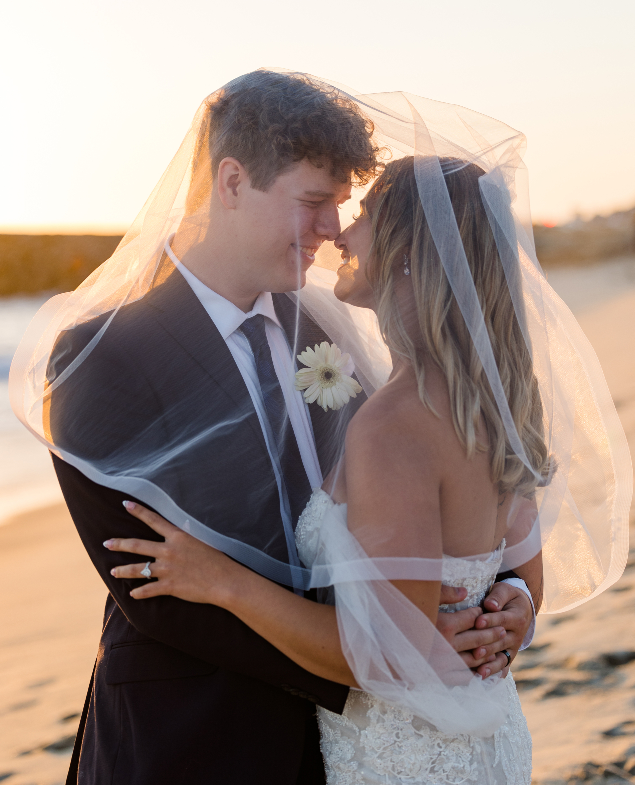 Bride and groom on the Carlsbad State beach on their wedding day captured by Carlsbad Photo