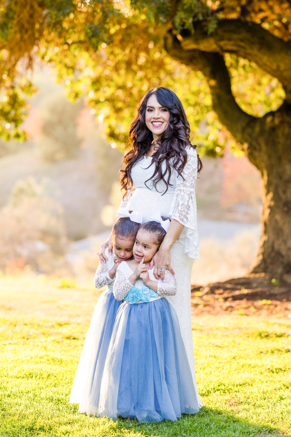 Family and maternity photo session captured by Carlsbad Photo at Balboa Park, San Diego