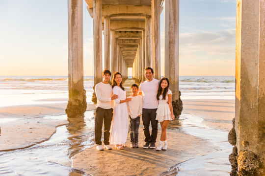 Family photo session captured by Carlsbad Photo at Scripps Pier La Jolla, San Diego